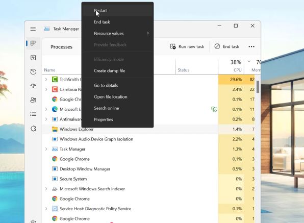 Right-clicking Windows Explorer in Task Manager to select Restart