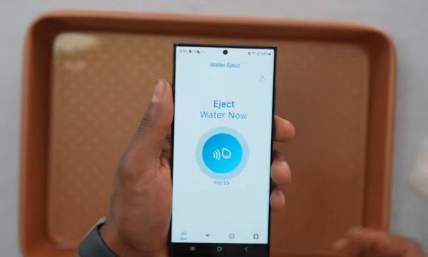 Tapping the Eject Water Now button inside the Clear Wave app