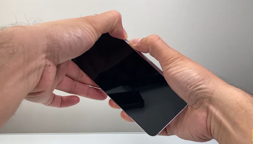 Holding down the Power and Volume Down buttons together on an Android phone